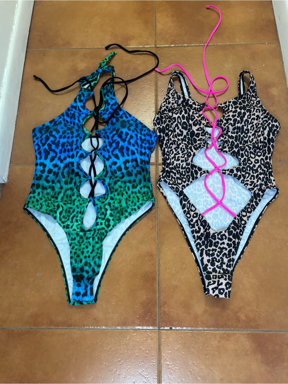 Woman’s swimsuit leopard print beautiful colors total of 2. Worn for a few hours